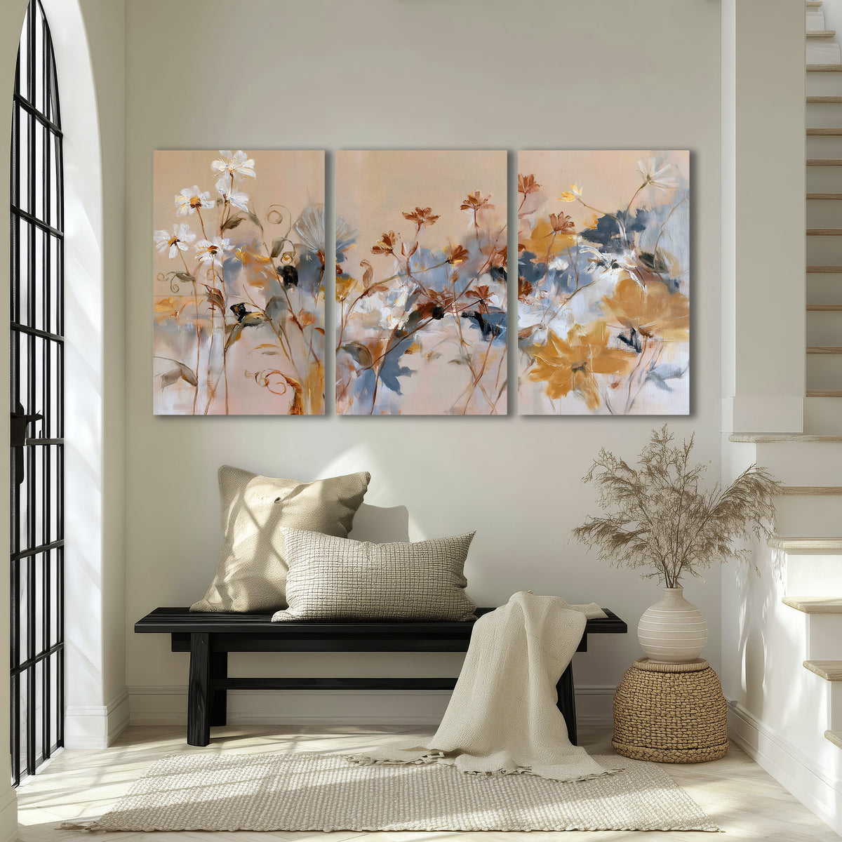Loose blue and ochre blossoms layered across a warm neutral background 3 piece canvas wall art displayed in a entryway