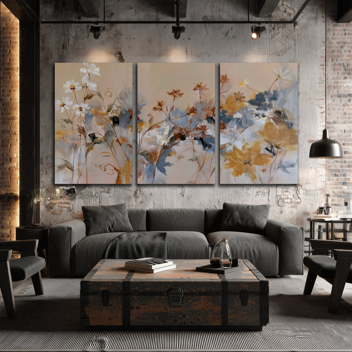 Loose blue and ochre blossoms layered across a warm neutral background 3 piece canvas wall art displayed in a industrial room