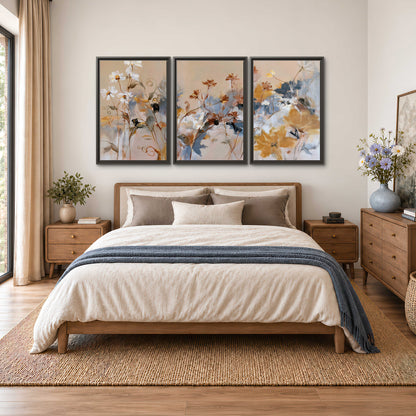 Loose blue and ochre blossoms layered across a warm neutral background 3 piece framed canvas wall art styled in an interior