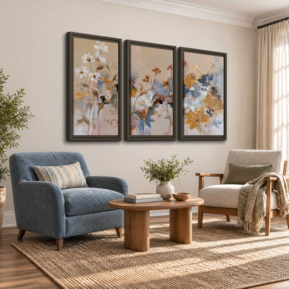 Loose blue and ochre blossoms layered across a warm neutral background 3 piece framed canvas wall art styled in an interior