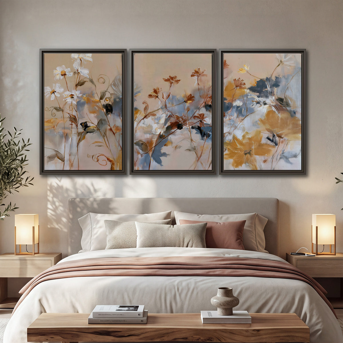 Loose blue and ochre blossoms layered across a warm neutral background 3 piece framed canvas wall art displayed in a bedroom