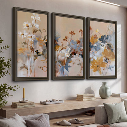 Loose blue and ochre blossoms layered across a warm neutral background 3 piece framed canvas wall art displayed in a console