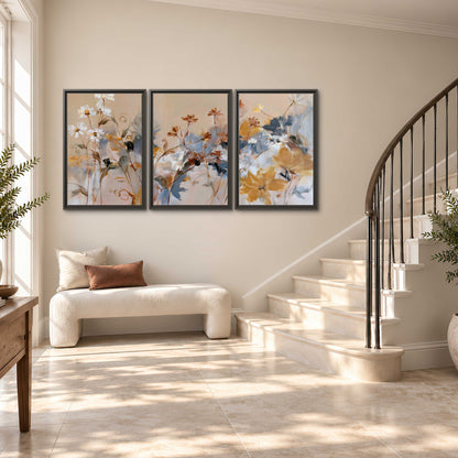 Loose blue and ochre blossoms layered across a warm neutral background 3 piece framed canvas wall art styled in an interior