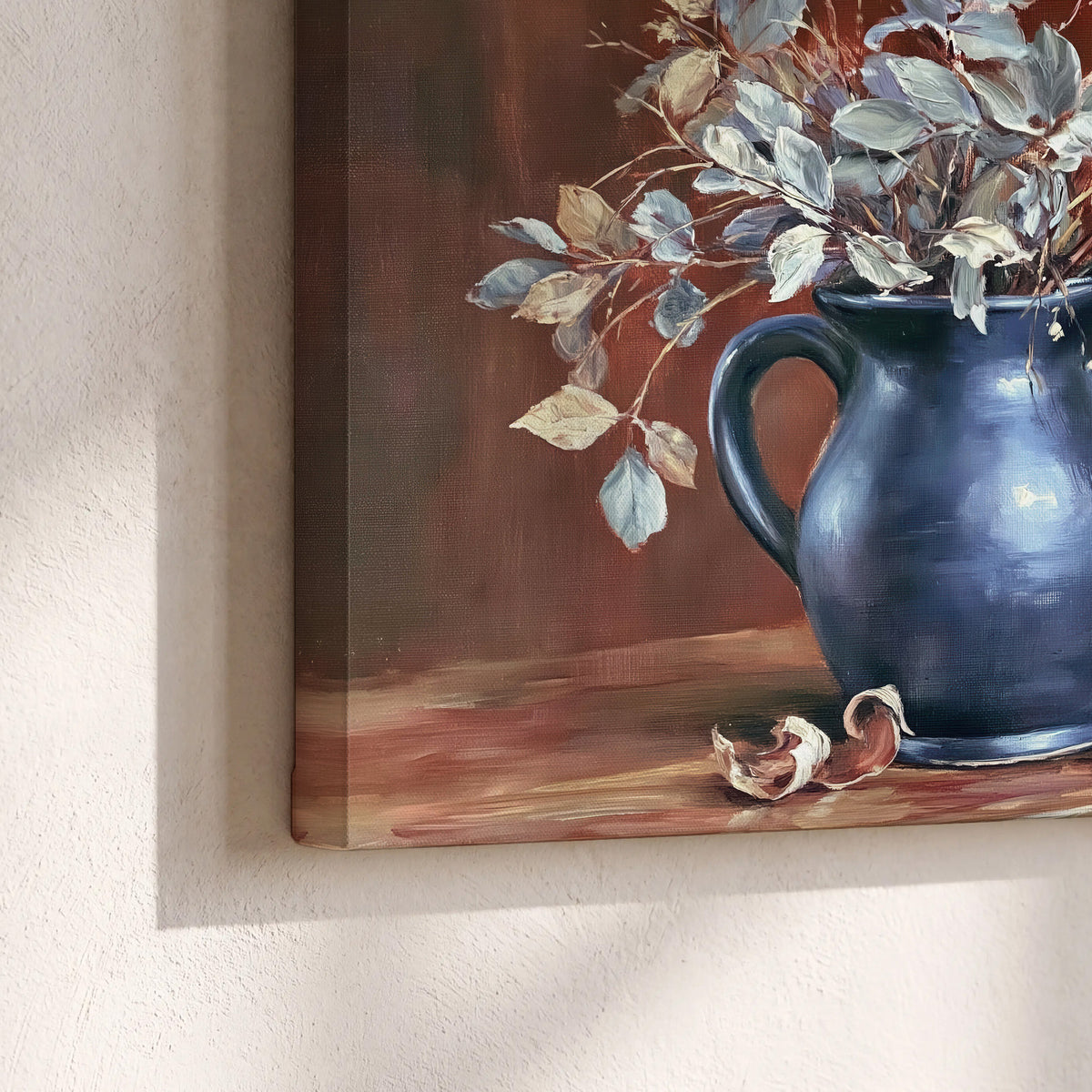 White flowering branches gathered in a deep blue pitcher against a warm rust-colored wall 3 piece canvas wall art material and edge close up