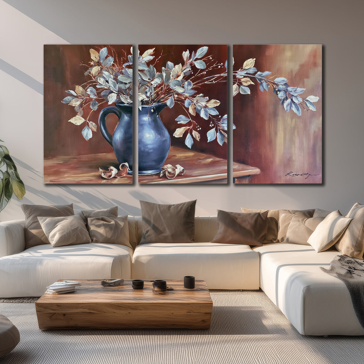 White flowering branches gathered in a deep blue pitcher against a warm rust-colored wall 3 piece canvas wall art displayed in a living room