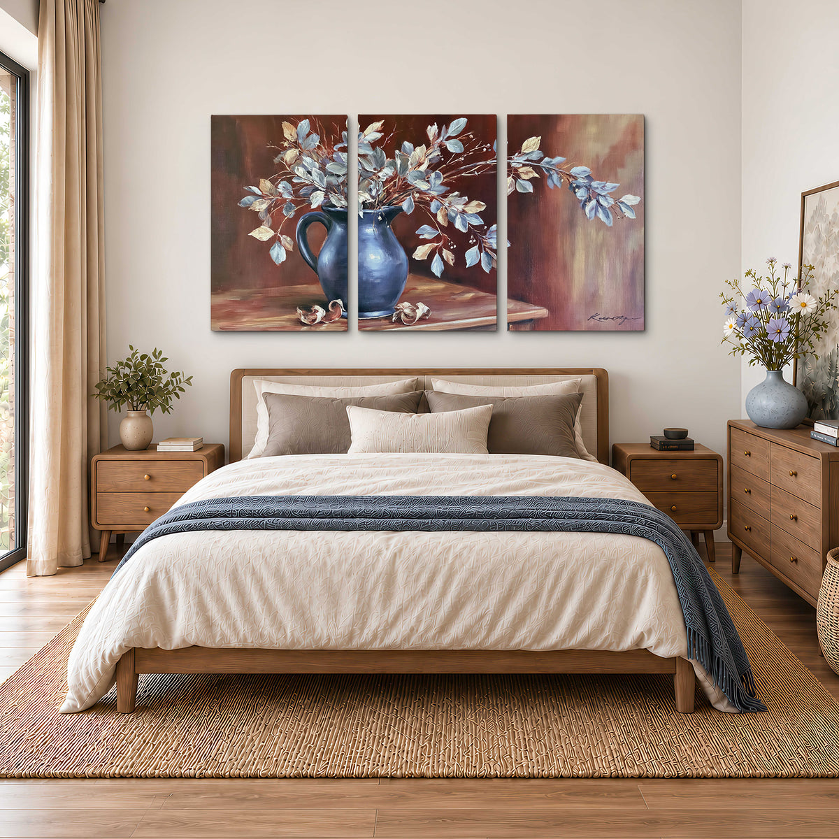 White flowering branches gathered in a deep blue pitcher against a warm rust-colored wall 3 piece canvas wall art styled in an interior
