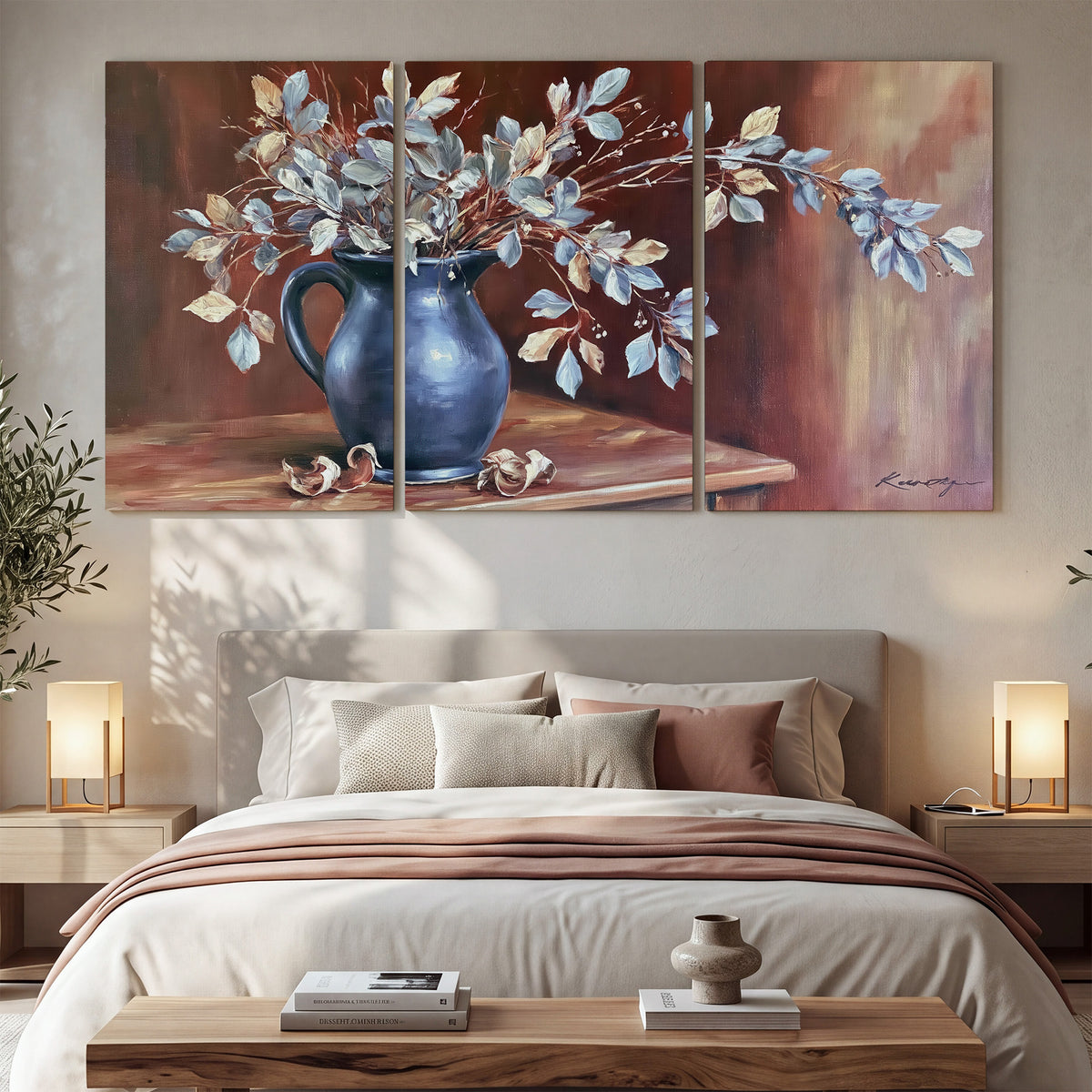 White flowering branches gathered in a deep blue pitcher against a warm rust-colored wall 3 piece canvas wall art displayed in a bedroom