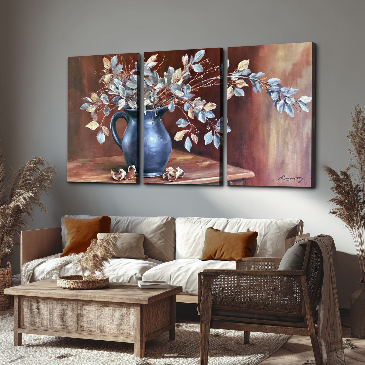White flowering branches gathered in a deep blue pitcher against a warm rust-colored wall 3 piece canvas wall art displayed in a rustic living room