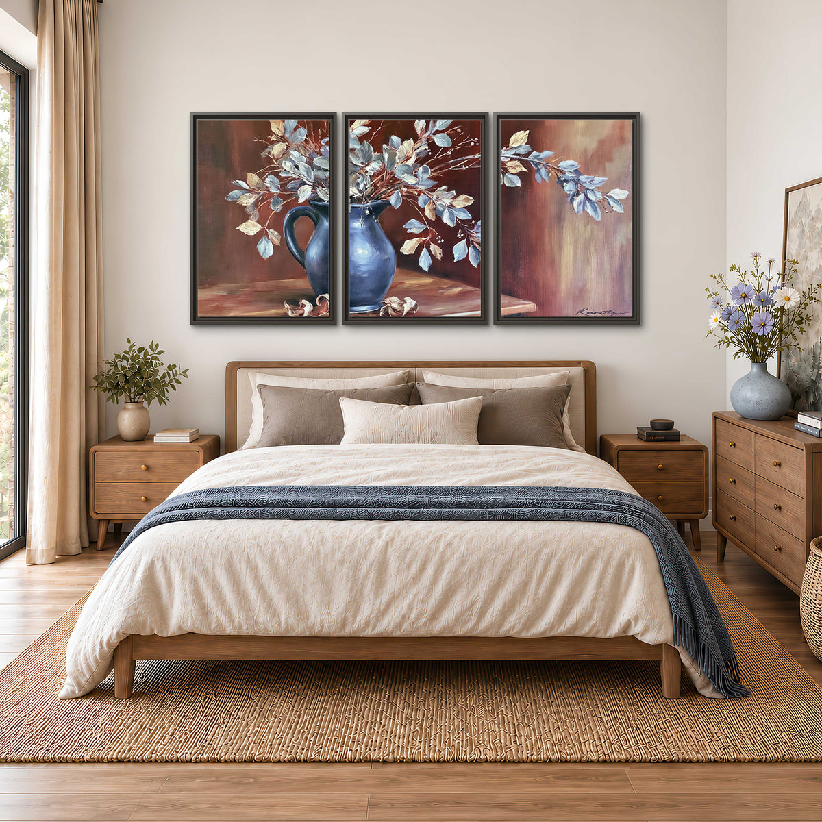 White flowering branches gathered in a deep blue pitcher against a warm rust-colored wall 3 piece framed canvas wall art styled in an interior