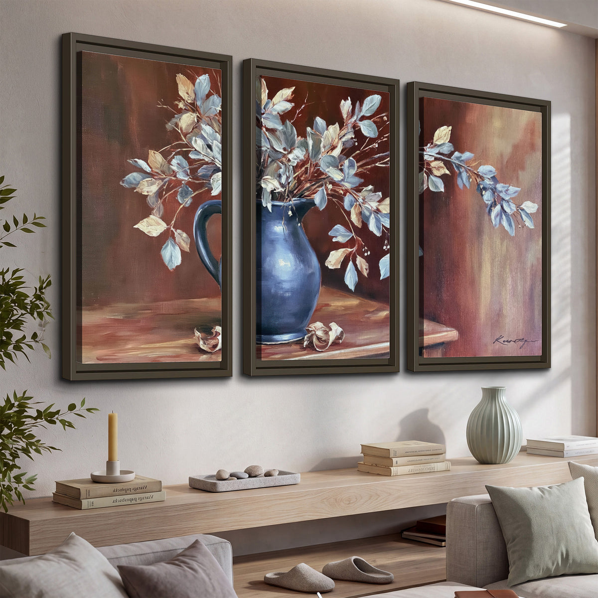 White flowering branches gathered in a deep blue pitcher against a warm rust-colored wall 3 piece framed canvas wall art displayed in a console
