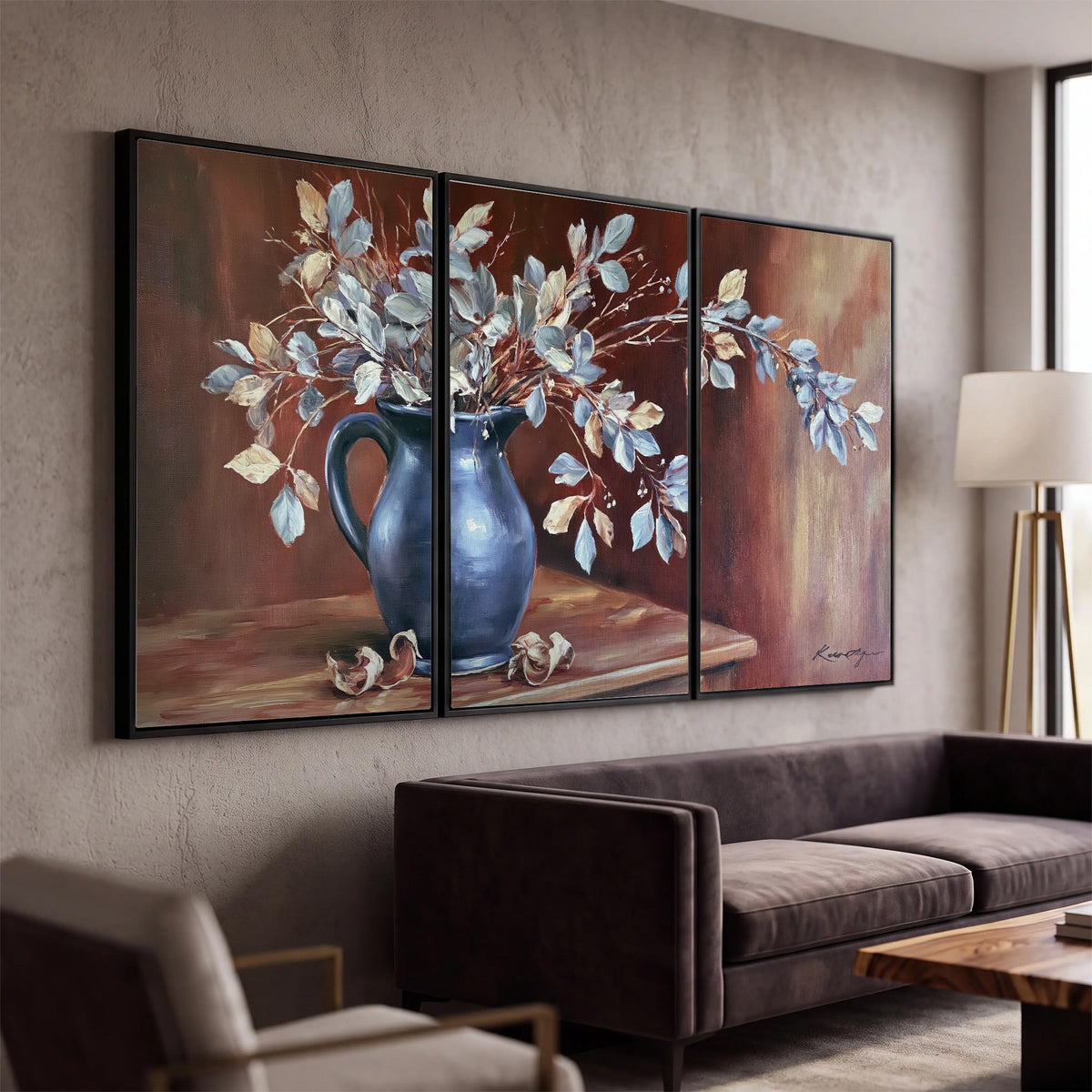 White flowering branches gathered in a deep blue pitcher against a warm rust-colored wall 3 piece framed canvas wall art displayed in a modern living room