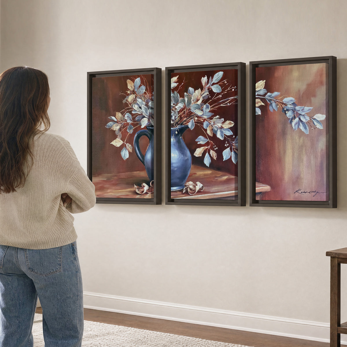 White flowering branches gathered in a deep blue pitcher against a warm rust-colored wall 3 piece framed canvas wall art three panel arrangement on a wall
