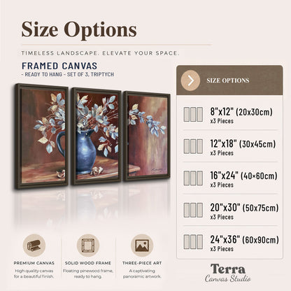 White flowering branches gathered in a deep blue pitcher against a warm rust-colored wall 3 piece framed canvas wall art available dimensions; triptych dimensions are per panel