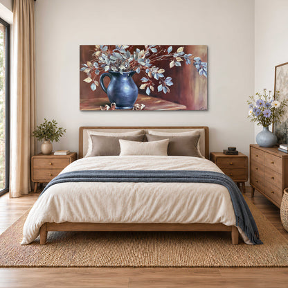 White flowering branches gathered in a deep blue pitcher against a warm rust-colored wall single canvas wall art styled in an interior
