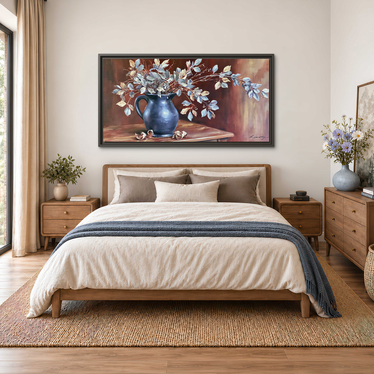 White flowering branches gathered in a deep blue pitcher against a warm rust-colored wall single framed canvas wall art styled in an interior