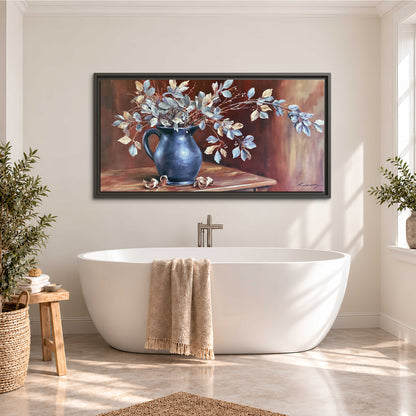 White flowering branches gathered in a deep blue pitcher against a warm rust-colored wall single framed canvas wall art styled in an interior