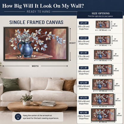 White flowering branches gathered in a deep blue pitcher against a warm rust-colored wall single framed canvas wall art size guide above a sofa; room view is illustrative