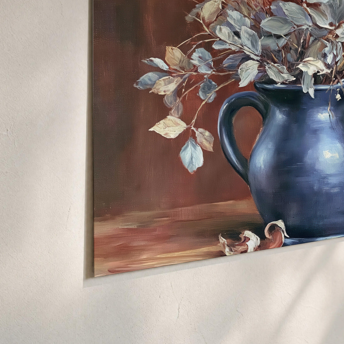 White flowering branches gathered in a deep blue pitcher against a warm rust-colored wall set of 3 poster prints material and edge close up