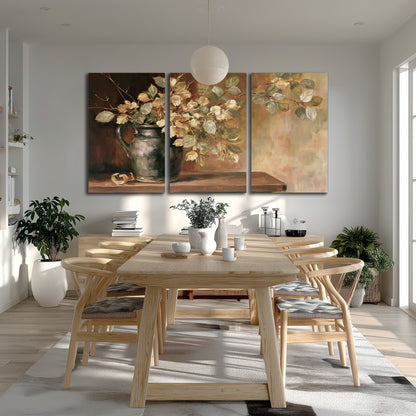 Pale golden blossoms and leaves in a dark green vase on a wooden ledge 3 piece canvas wall art room and product view