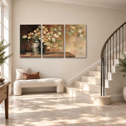 Pale golden blossoms and leaves in a dark green vase on a wooden ledge 3 piece canvas wall art styled in an interior