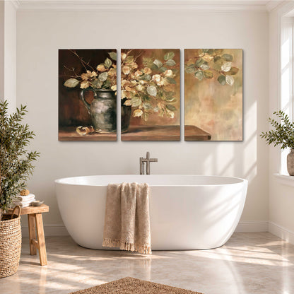 Pale golden blossoms and leaves in a dark green vase on a wooden ledge 3 piece canvas wall art styled in an interior