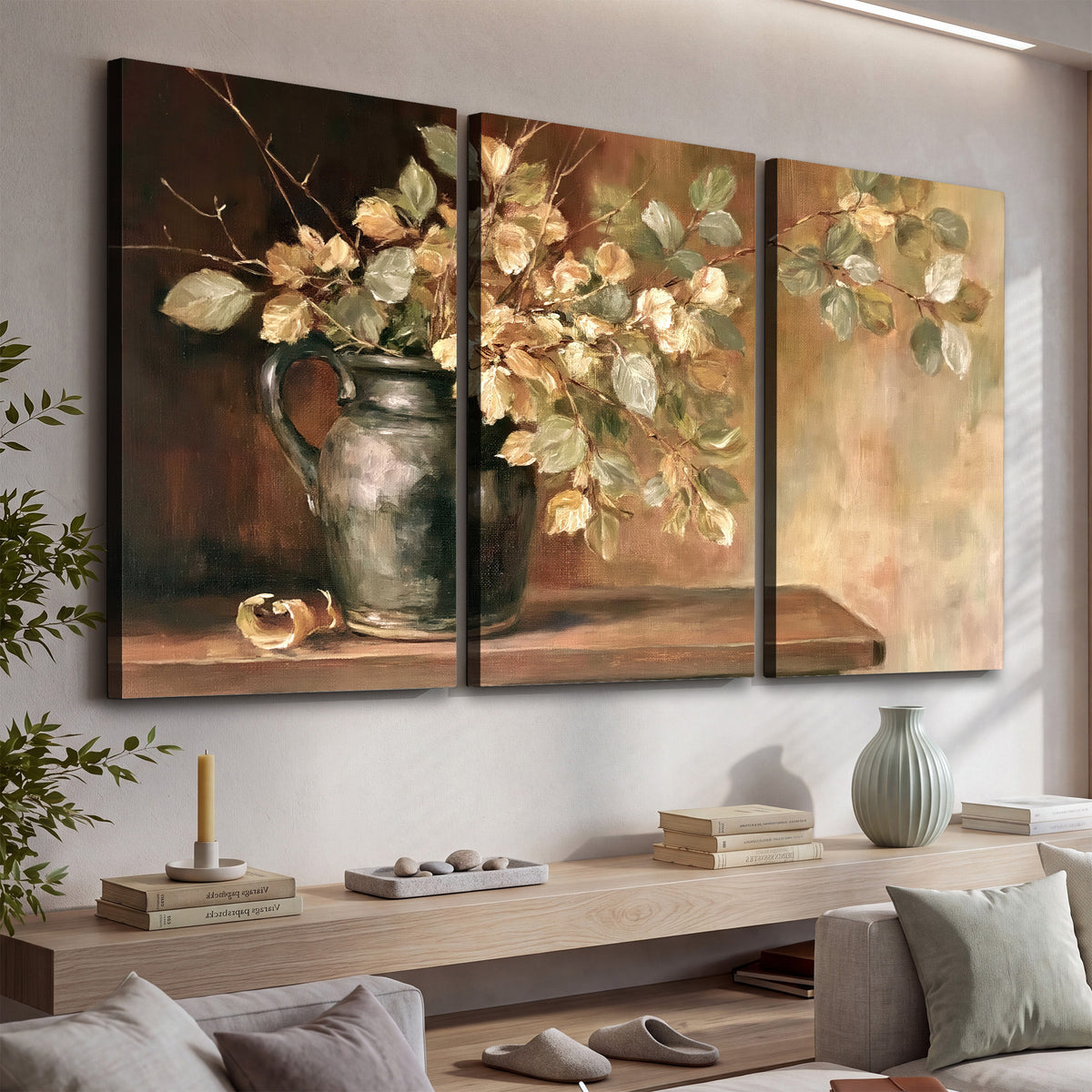 Pale golden blossoms and leaves in a dark green vase on a wooden ledge 3 piece canvas wall art displayed in a console