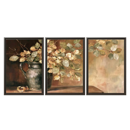 Pale golden blossoms and leaves in a dark green vase on a wooden ledge 3 piece framed canvas wall art viewed straight on