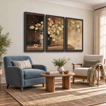 Pale golden blossoms and leaves in a dark green vase on a wooden ledge 3 piece framed canvas wall art styled in an interior
