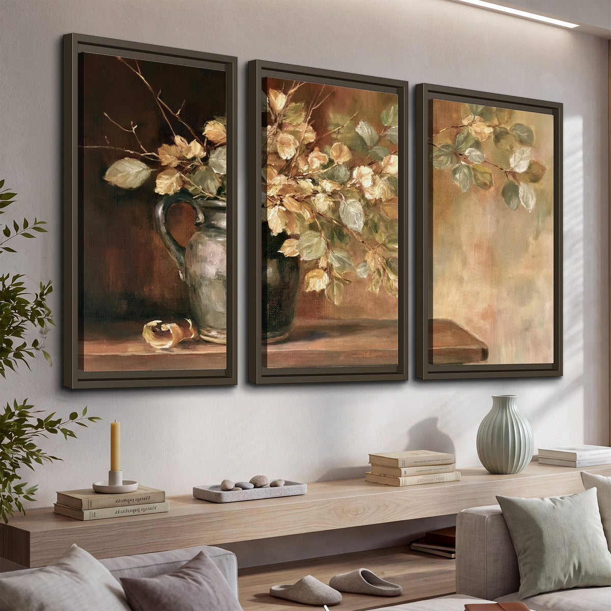Pale golden blossoms and leaves in a dark green vase on a wooden ledge 3 piece framed canvas wall art displayed in a console