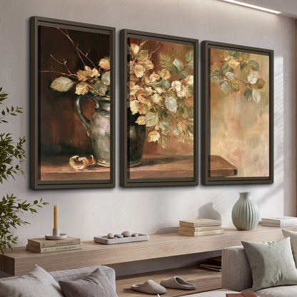 Pale golden blossoms and leaves in a dark green vase on a wooden ledge 3 piece framed canvas wall art displayed in a console