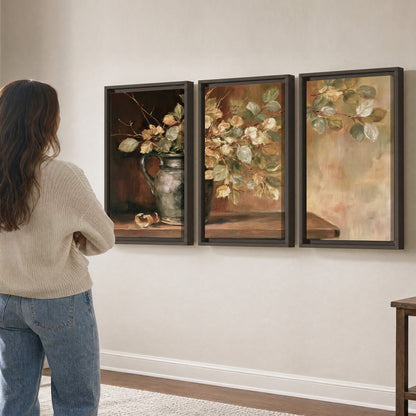 Pale golden blossoms and leaves in a dark green vase on a wooden ledge 3 piece framed canvas wall art three panel arrangement on a wall