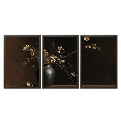 Fine flowering branches in a small dark vase on a wooden table against a deep brown background 3 piece framed canvas wall art viewed straight on
