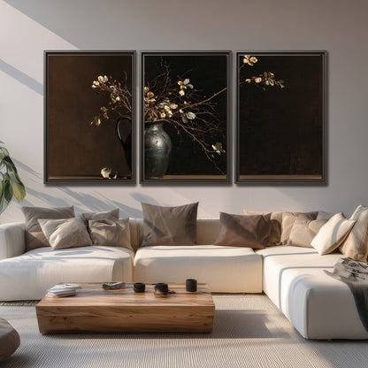 Fine flowering branches in a small dark vase on a wooden table against a deep brown background 3 piece framed canvas wall art displayed in a living room