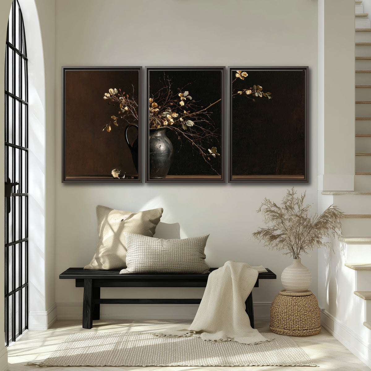 Fine flowering branches in a small dark vase on a wooden table against a deep brown background 3 piece framed canvas wall art displayed in a entryway