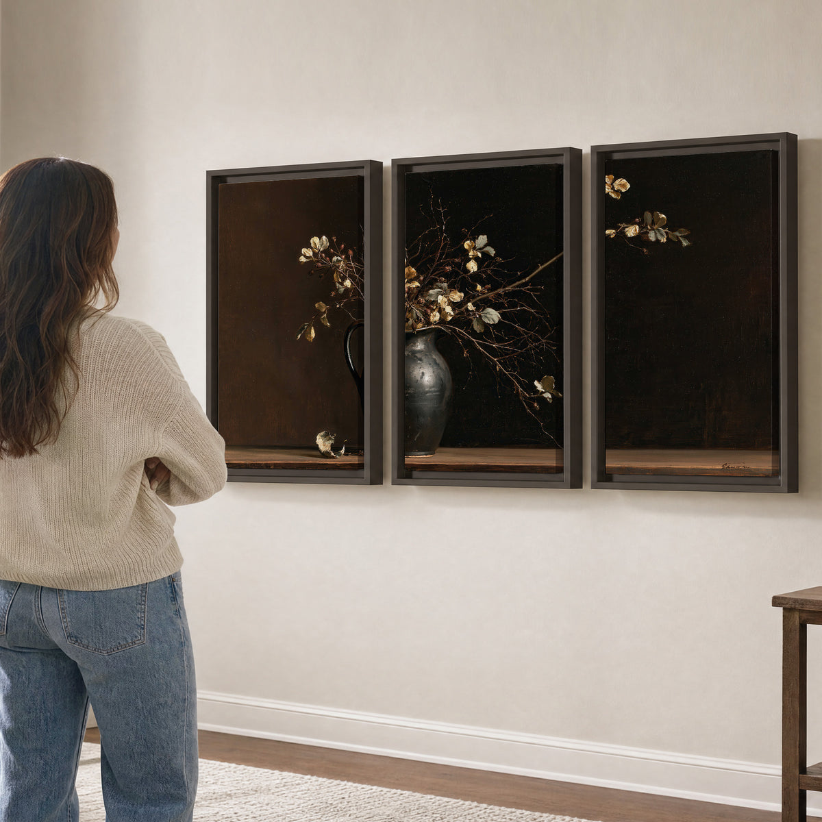 Fine flowering branches in a small dark vase on a wooden table against a deep brown background 3 piece framed canvas wall art three panel arrangement on a wall
