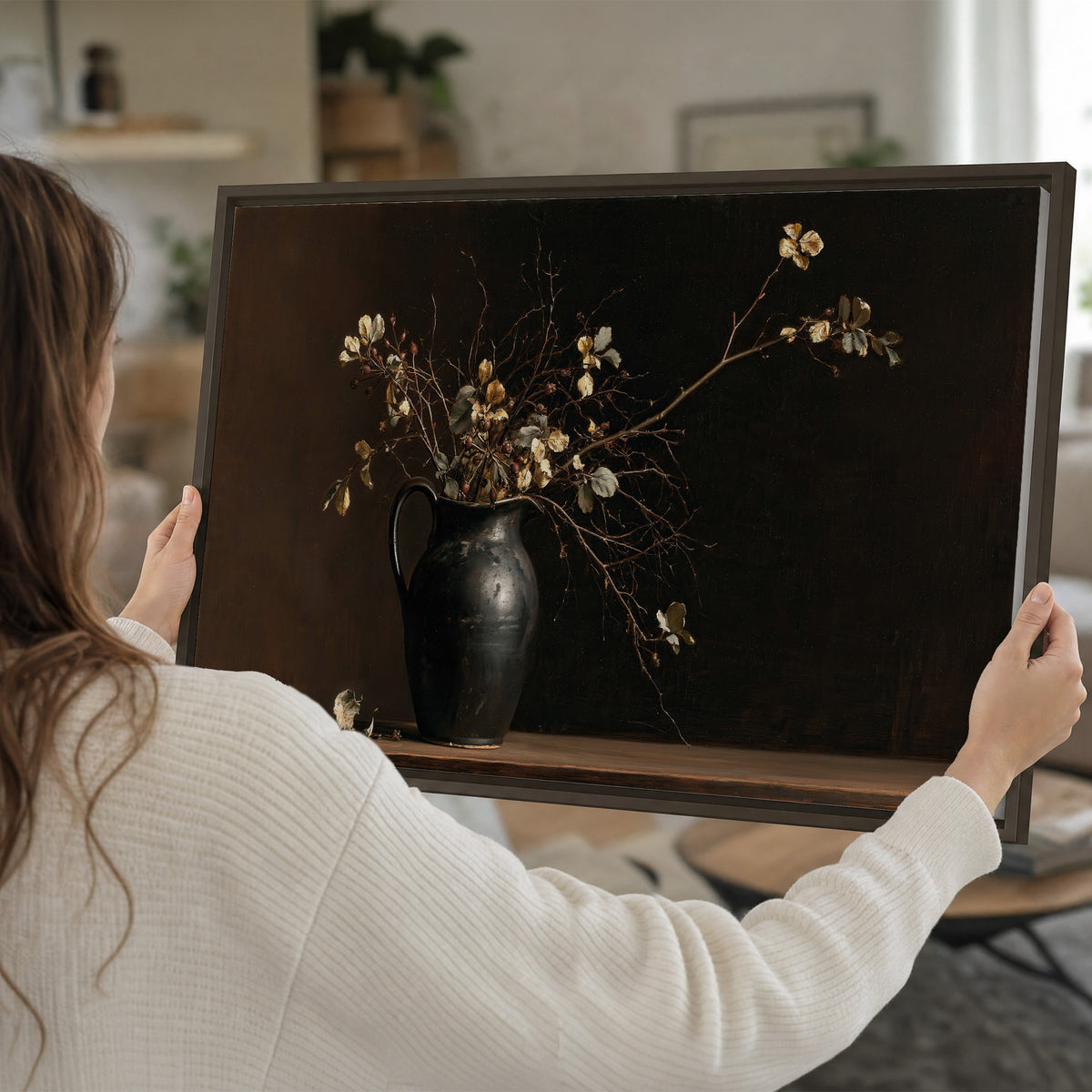 Fine flowering branches in a small dark vase on a wooden table against a deep brown background single framed canvas wall art held in hands