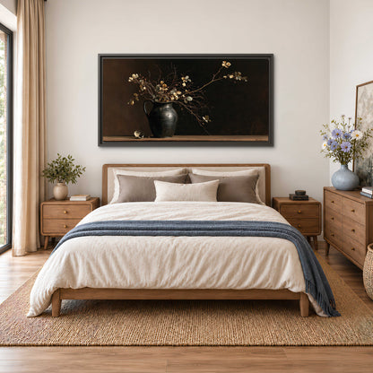 Fine flowering branches in a small dark vase on a wooden table against a deep brown background single framed canvas wall art styled in an interior