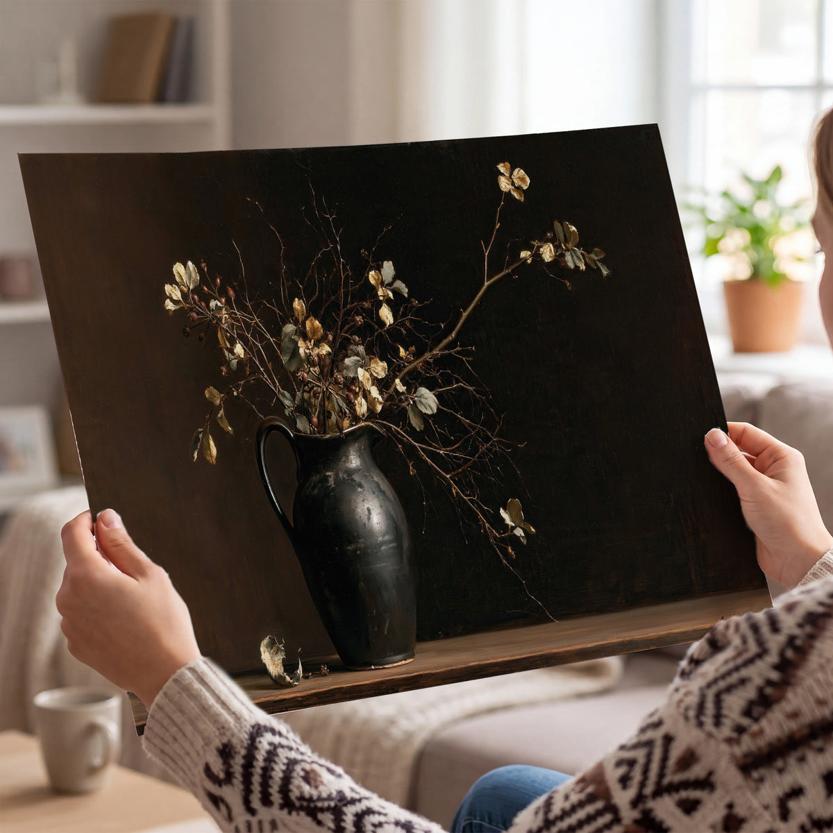 Fine flowering branches in a small dark vase on a wooden table against a deep brown background single poster print held in hands