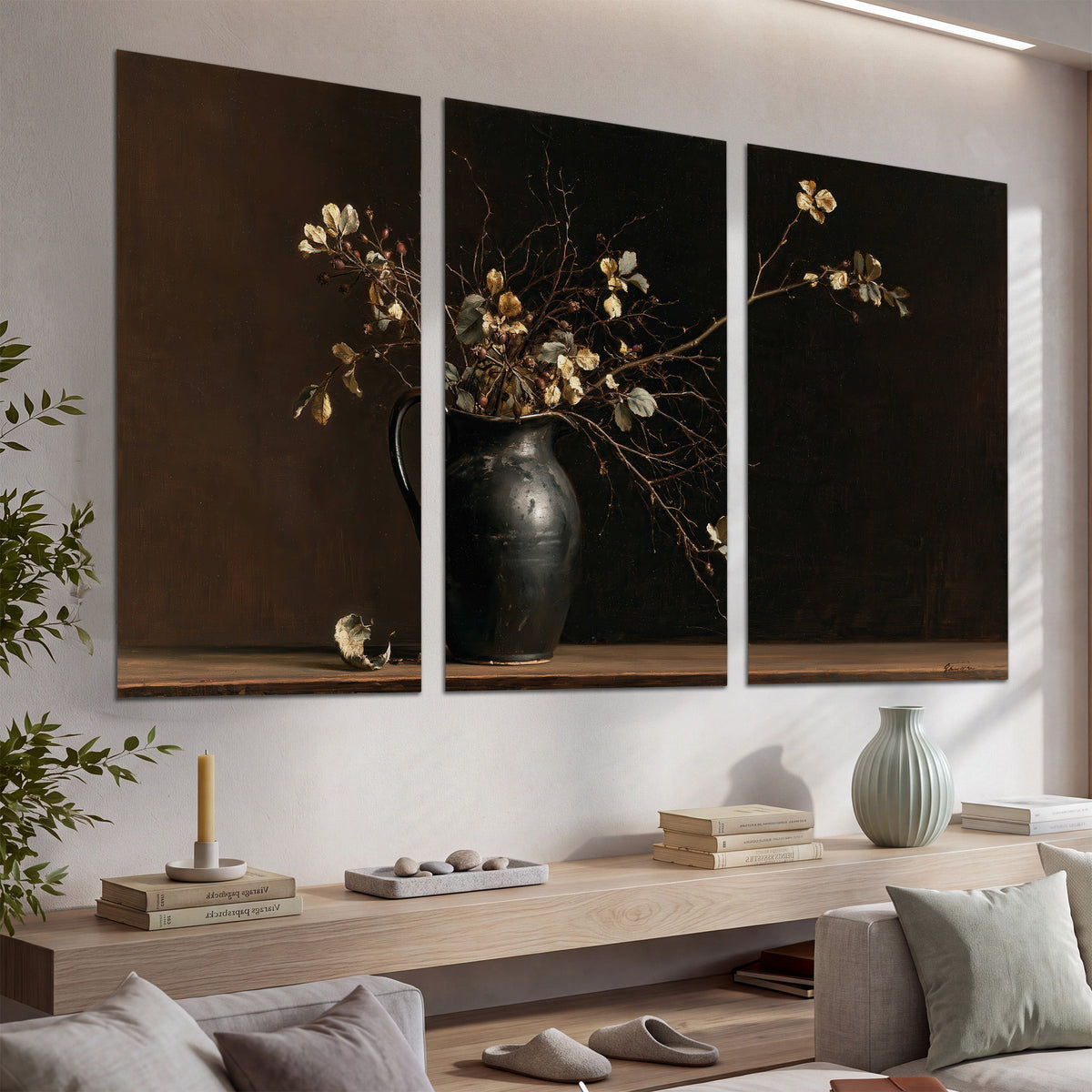 Fine flowering branches in a small dark vase on a wooden table against a deep brown background set of 3 poster prints displayed in a console