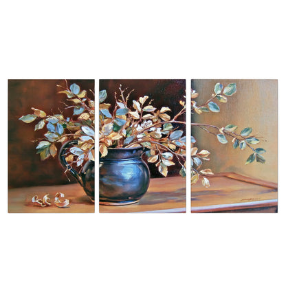 White and peach flowering branches arranged in a blue vase against a warm ochre background 3 piece canvas wall art viewed straight on