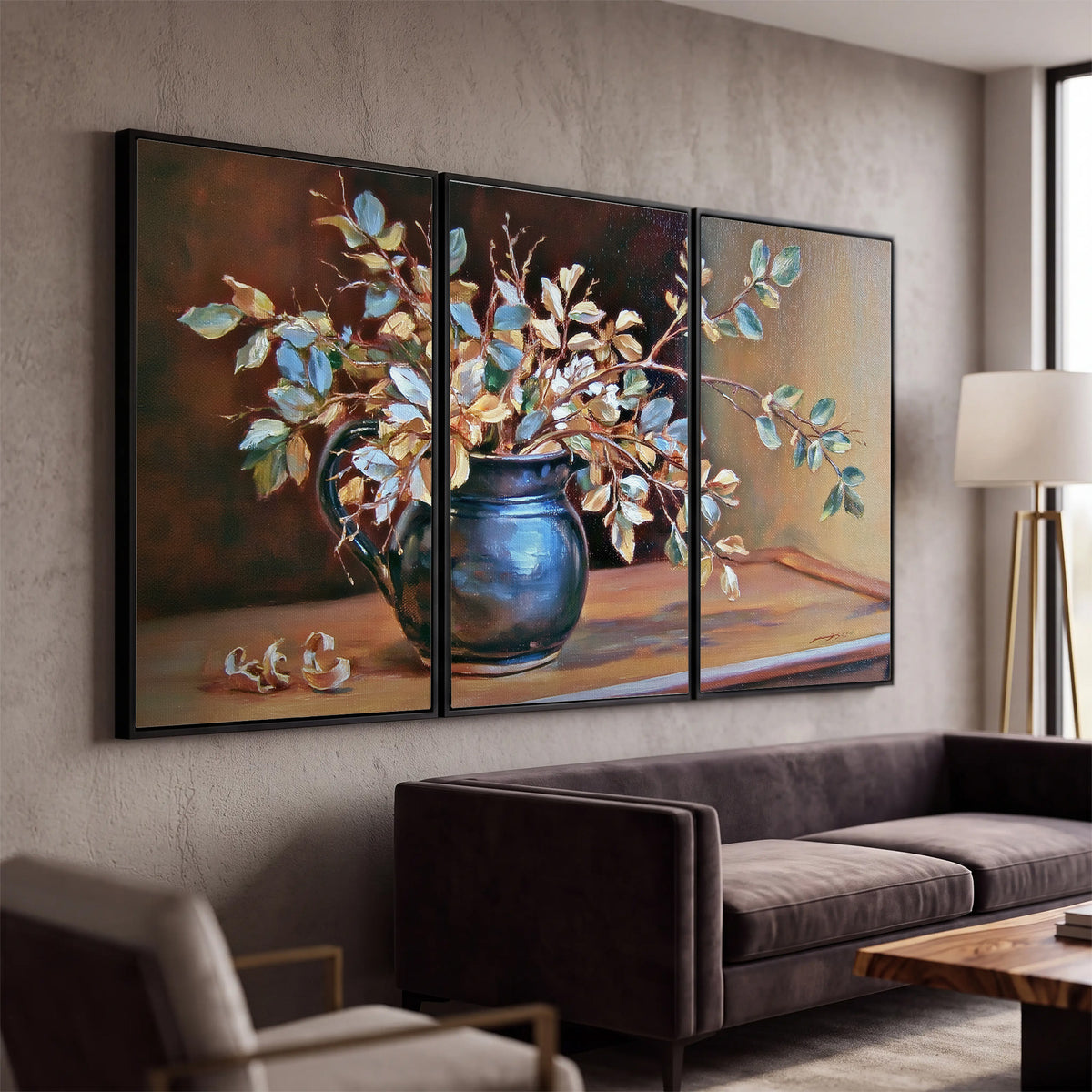 White and peach flowering branches arranged in a blue vase against a warm ochre background 3 piece framed canvas wall art displayed in a modern living room