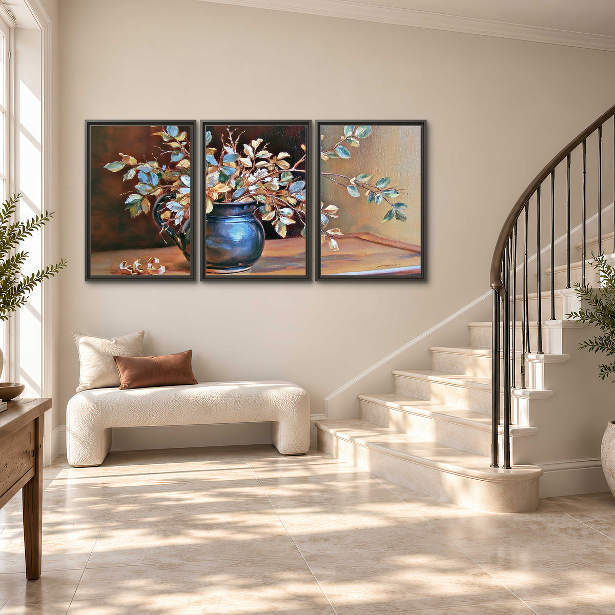 White and peach flowering branches arranged in a blue vase against a warm ochre background 3 piece framed canvas wall art styled in an interior