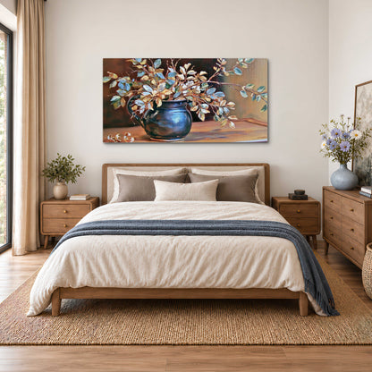 White and peach flowering branches arranged in a blue vase against a warm ochre background single canvas wall art styled in an interior