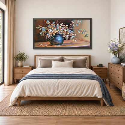 White and peach flowering branches arranged in a blue vase against a warm ochre background single framed canvas wall art styled in an interior