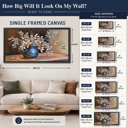 White and peach flowering branches arranged in a blue vase against a warm ochre background single framed canvas wall art size guide above a sofa; room view is illustrative