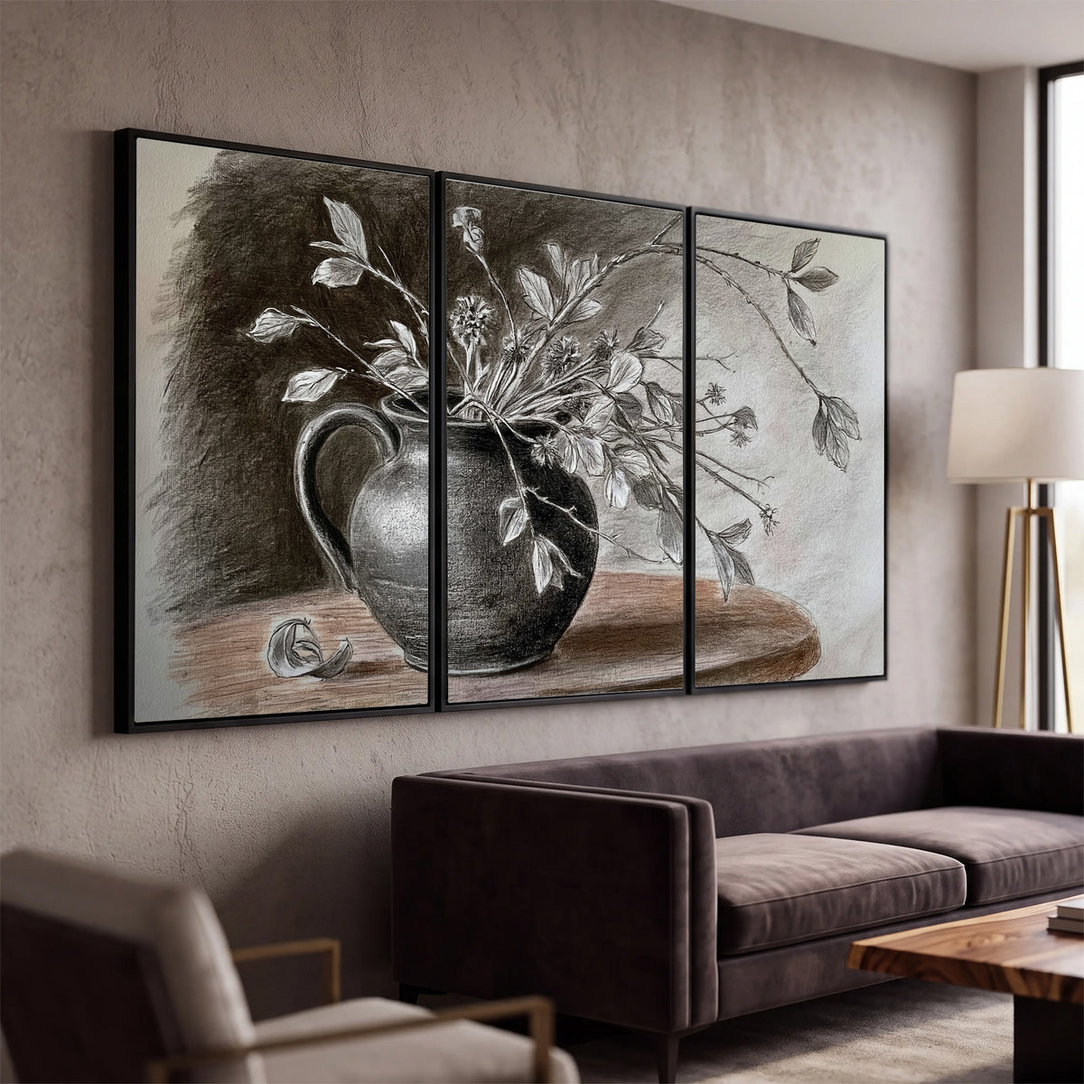 Fine leafy branches spilling from a dark rounded vase in a soft monochrome still life 3 piece framed canvas wall art displayed in a modern living room
