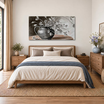 Fine leafy branches spilling from a dark rounded vase in a soft monochrome still life single canvas wall art styled in an interior