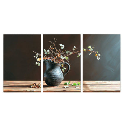 A delicate arrangement of pale blossoms in a blue vase on a sunlit wooden table 3 piece canvas wall art viewed straight on