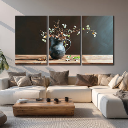 A delicate arrangement of pale blossoms in a blue vase on a sunlit wooden table 3 piece canvas wall art displayed in a living room