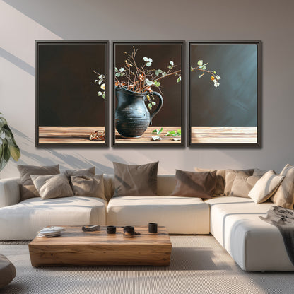 A delicate arrangement of pale blossoms in a blue vase on a sunlit wooden table 3 piece framed canvas wall art displayed in a living room